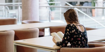 millennial woman reading a book