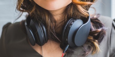woman with headphones around her neck